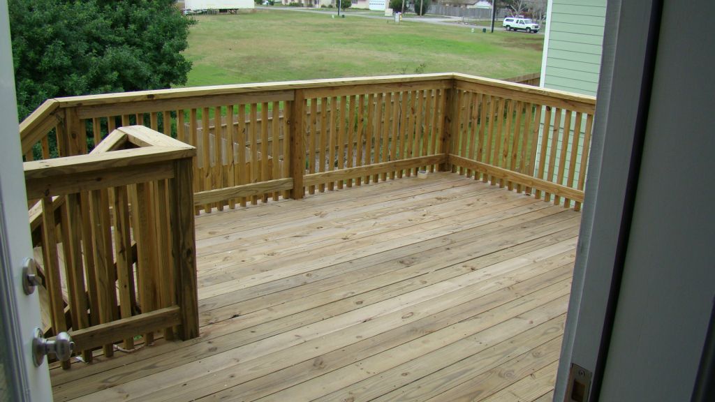 ELEVATED WOOD DECK with HANDRAILS at BACK YARD